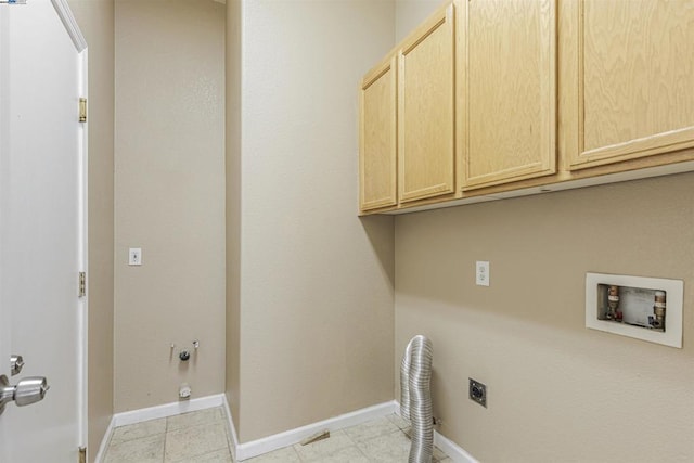 clothes washing area featuring cabinets, washer hookup, hookup for an electric dryer, and hookup for a gas dryer