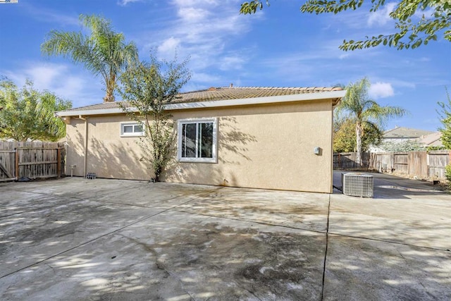 back of property featuring a patio area