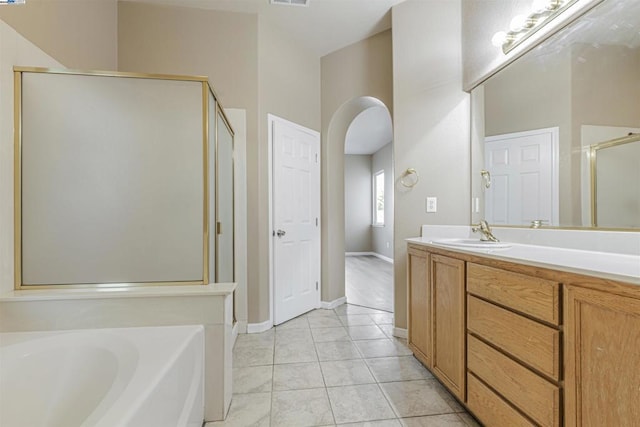 bathroom featuring vanity, separate shower and tub, and tile patterned floors