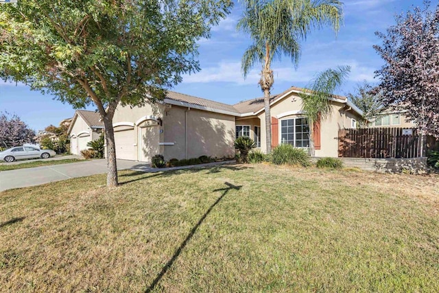 single story home featuring a garage and a front yard