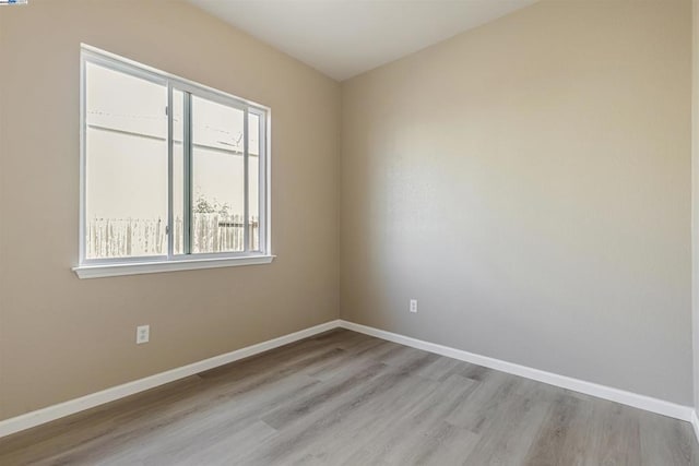 unfurnished room featuring light hardwood / wood-style floors