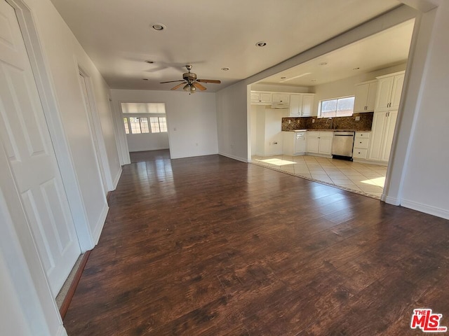 unfurnished living room with light hardwood / wood-style flooring and ceiling fan