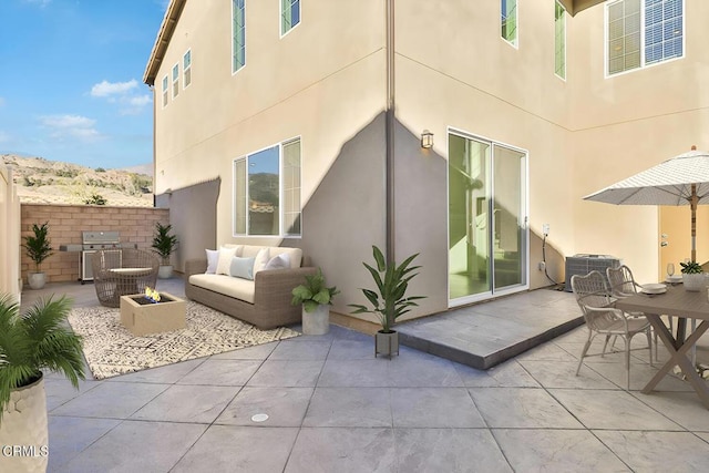 view of patio featuring outdoor lounge area and central AC unit