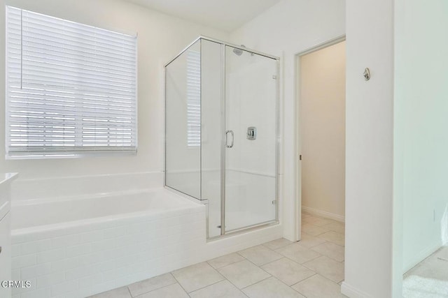 bathroom featuring shower with separate bathtub and tile patterned flooring