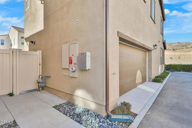 view of side of property featuring a garage