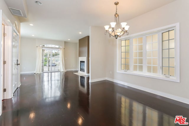 interior space with dark hardwood / wood-style flooring and a chandelier