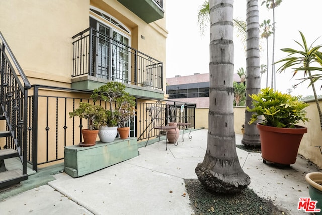 view of patio with a balcony