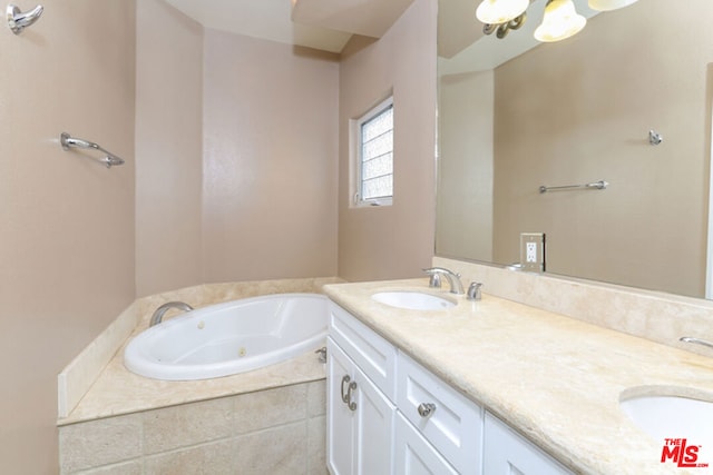 bathroom featuring vanity and tiled tub