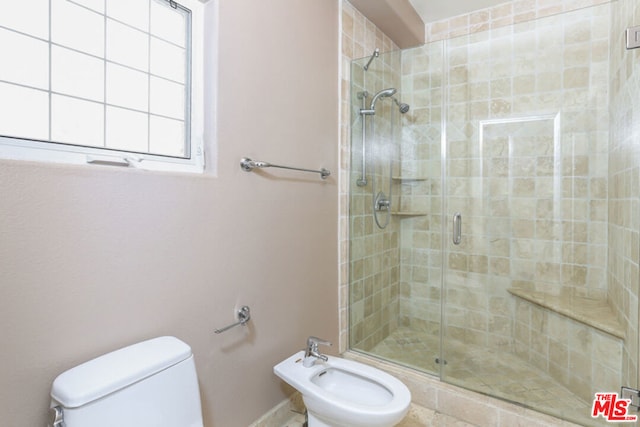 bathroom with a bidet, a shower with door, and toilet