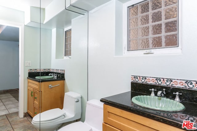 bathroom with vanity and toilet