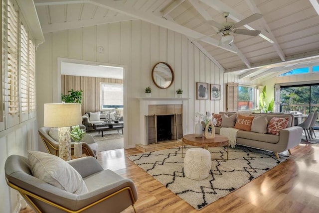 living room with plenty of natural light and lofted ceiling with beams