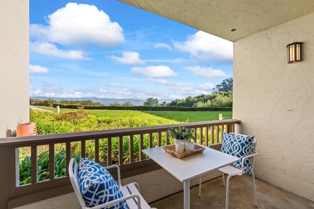 balcony featuring a rural view