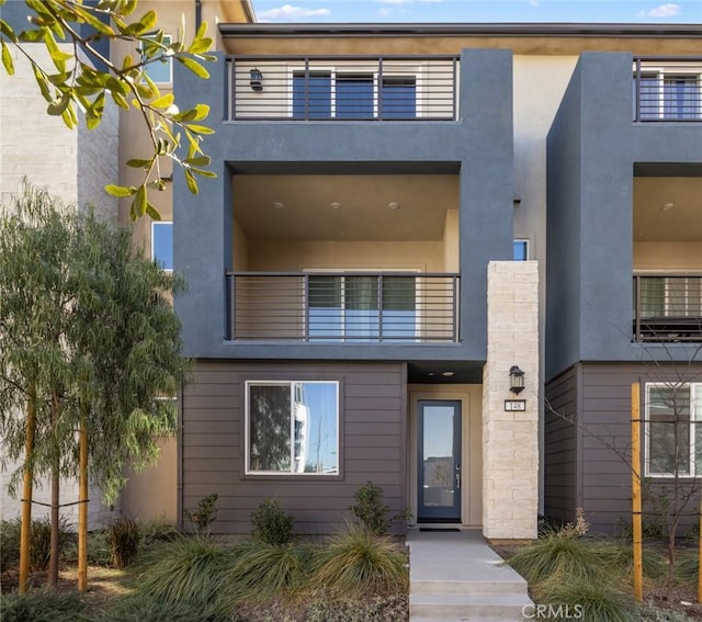 contemporary home with a balcony