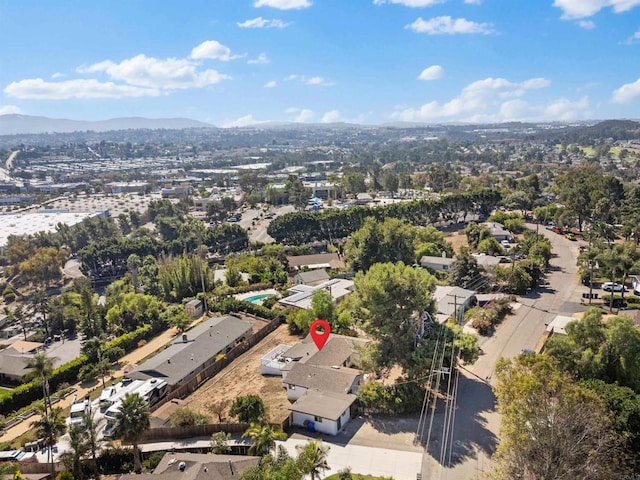 birds eye view of property with a mountain view