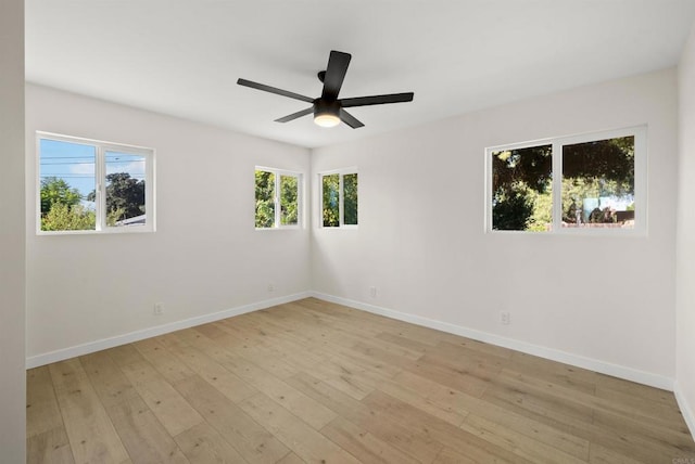 unfurnished room featuring light hardwood / wood-style floors and ceiling fan