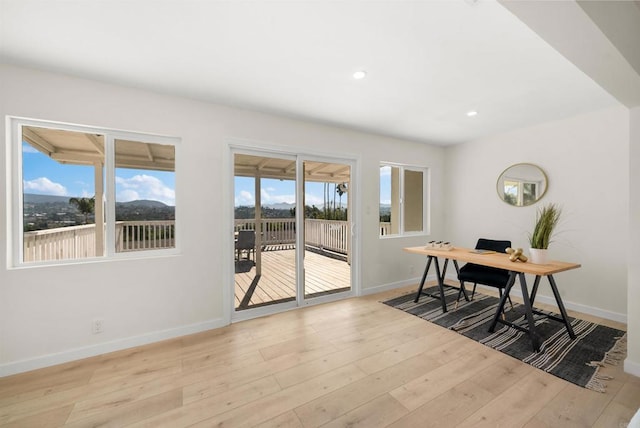 office space with light hardwood / wood-style floors