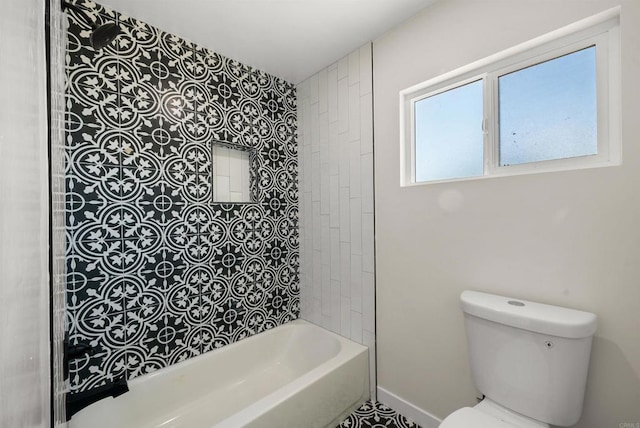 bathroom with shower / bathing tub combination and toilet