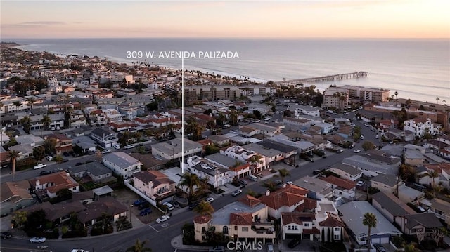 aerial view at dusk with a water view