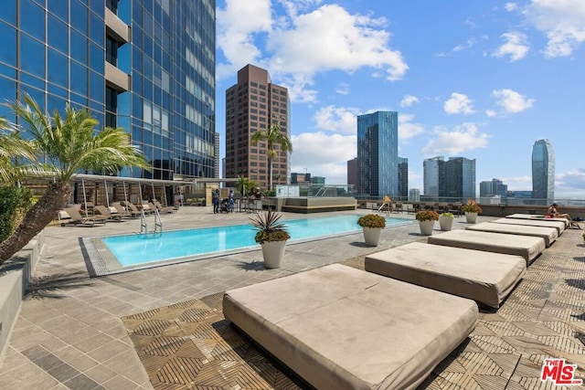 view of pool featuring a patio area