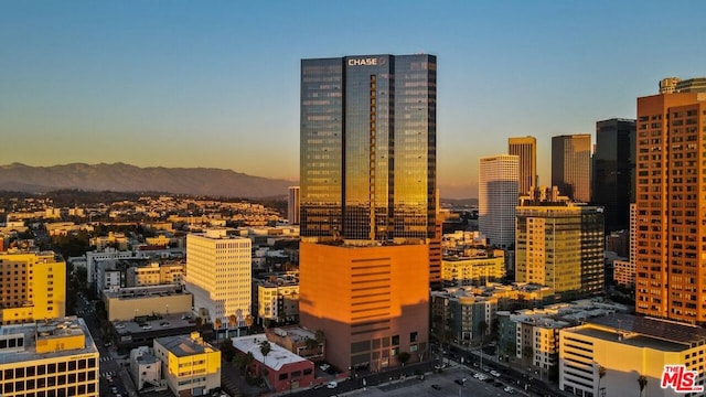 property's view of city featuring a mountain view