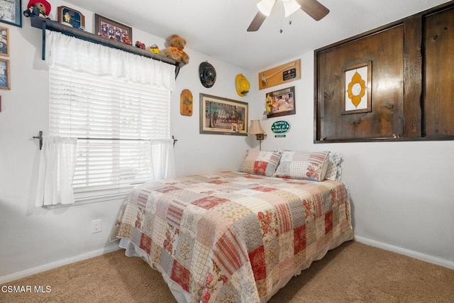 carpeted bedroom with ceiling fan