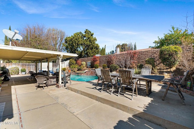 view of patio featuring a fenced in pool