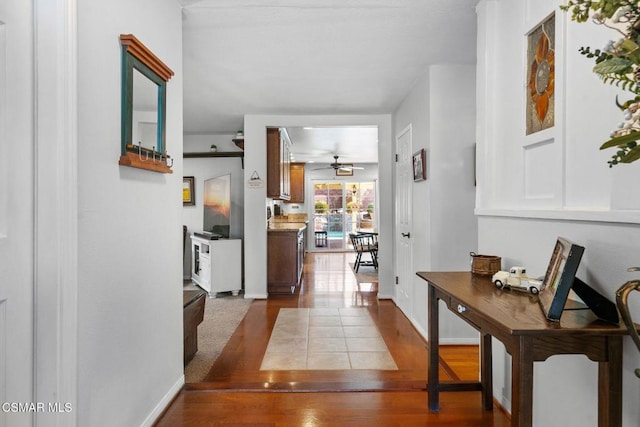 hall with light wood-type flooring