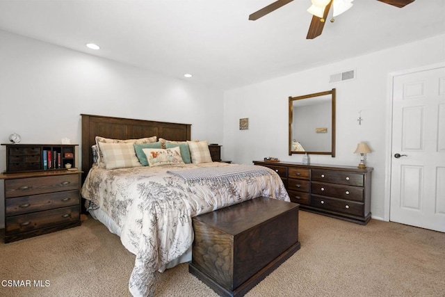 bedroom featuring light colored carpet and ceiling fan