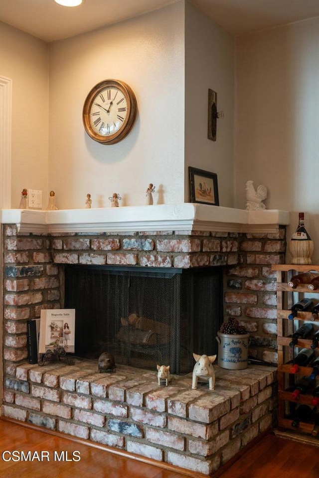 room details featuring hardwood / wood-style flooring and a fireplace