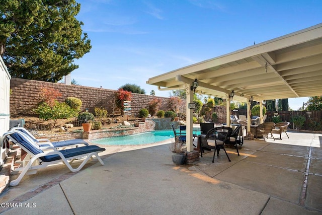 view of pool featuring a patio and pool water feature