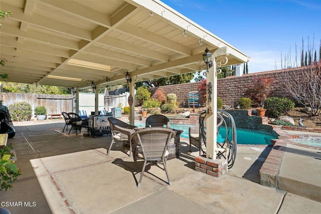 view of patio featuring a fenced in pool