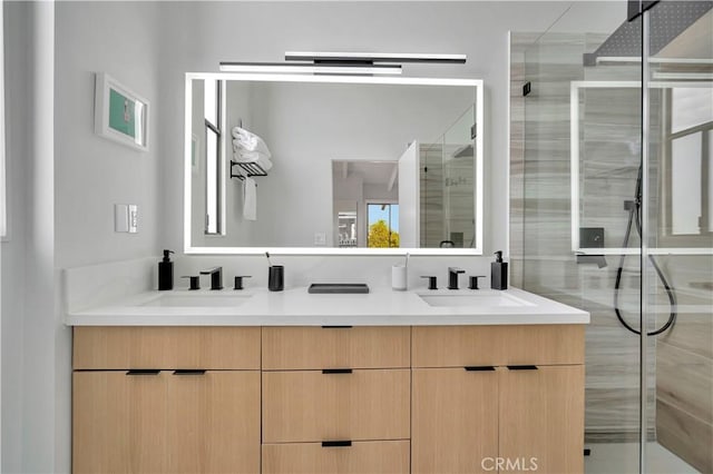 bathroom featuring vanity and an enclosed shower