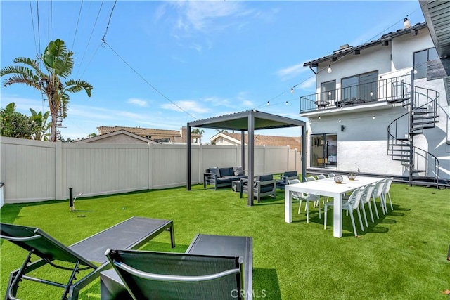 view of yard with a balcony and an outdoor hangout area