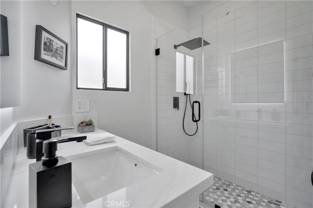 bathroom with an enclosed shower and vanity