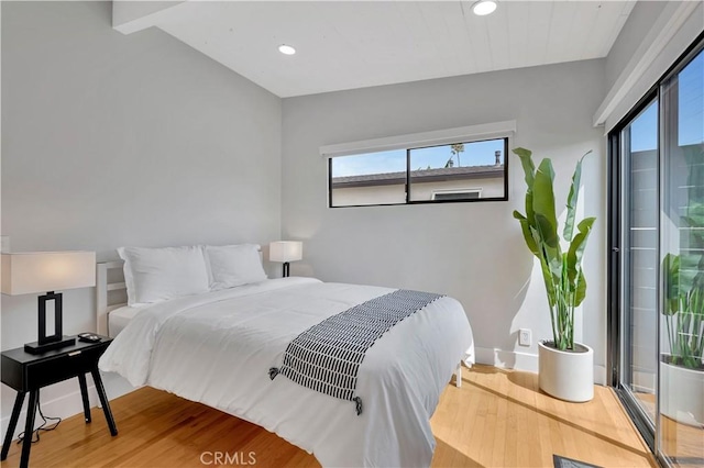 bedroom with hardwood / wood-style floors