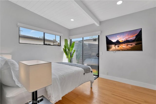 bedroom with hardwood / wood-style flooring, wooden ceiling, beam ceiling, and access to outside