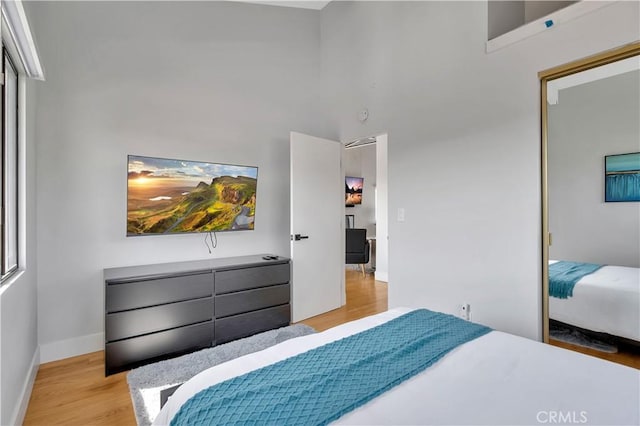 bedroom with light hardwood / wood-style flooring