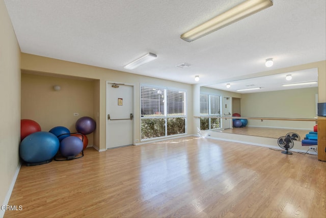 exercise area featuring light wood-type flooring