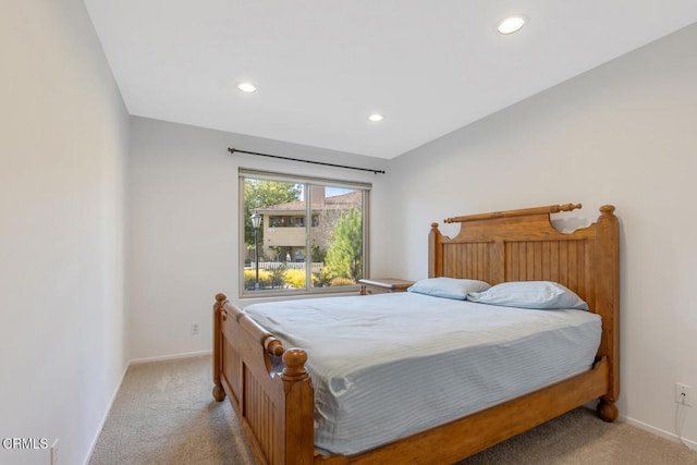 bedroom featuring light carpet