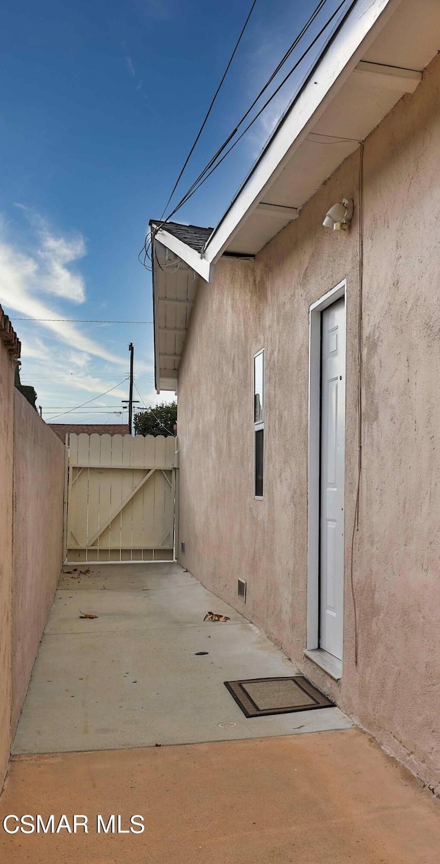 view of property exterior with a patio