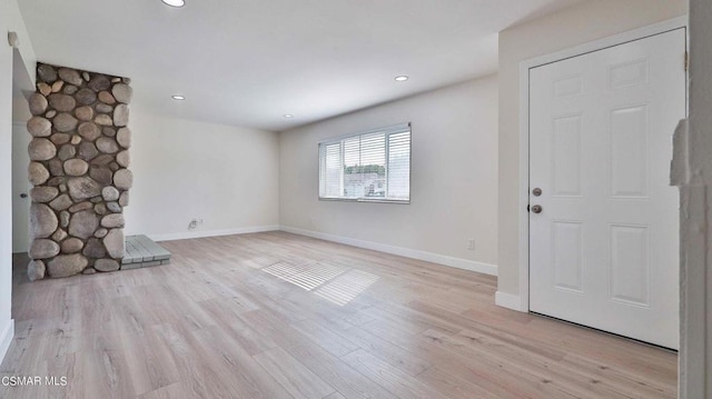 unfurnished living room featuring light hardwood / wood-style floors