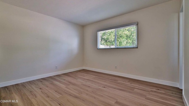 unfurnished room featuring light hardwood / wood-style floors