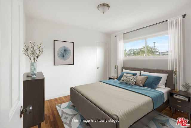 bedroom featuring dark hardwood / wood-style floors