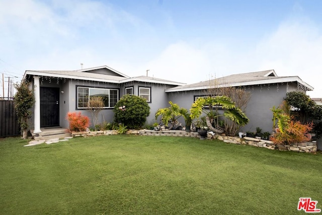 ranch-style house with a front lawn