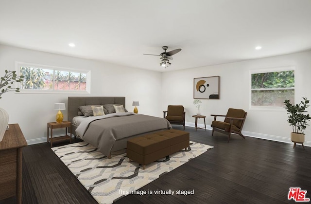 bedroom featuring dark hardwood / wood-style flooring and ceiling fan