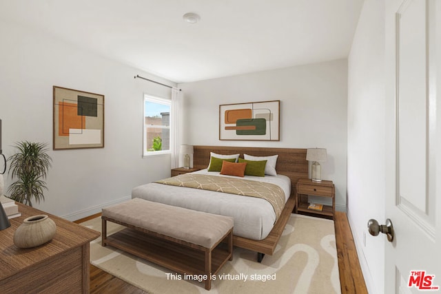 bedroom featuring wood-type flooring