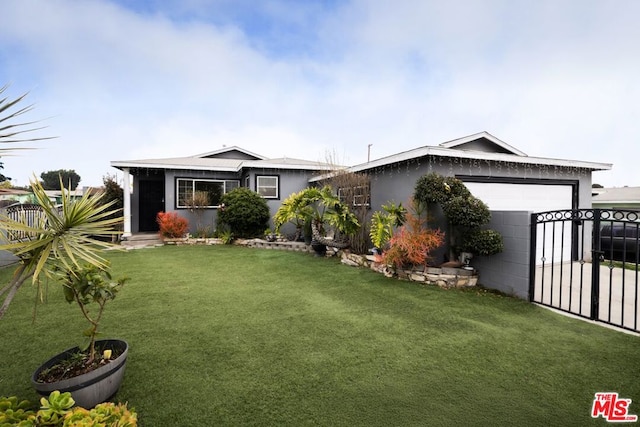 view of front of house with a garage and a front yard