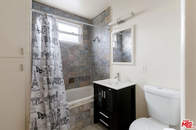 full bathroom featuring shower / tub combo, vanity, and toilet