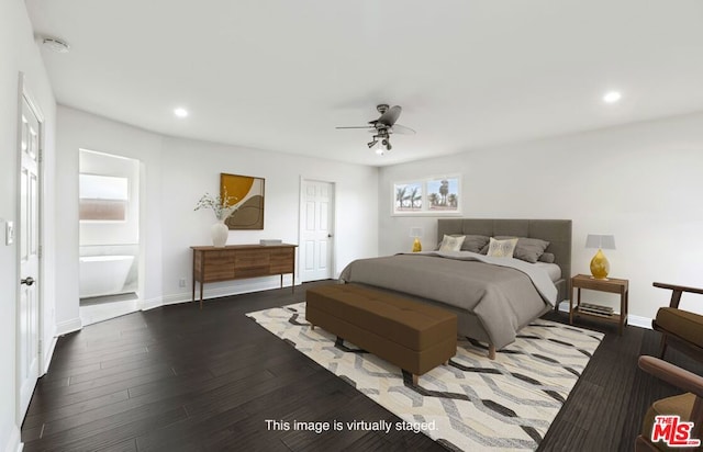 bedroom featuring dark hardwood / wood-style flooring, ceiling fan, and ensuite bath