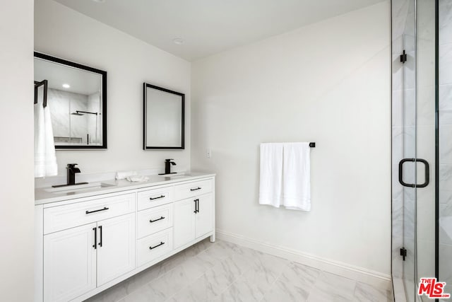 bathroom with vanity and an enclosed shower